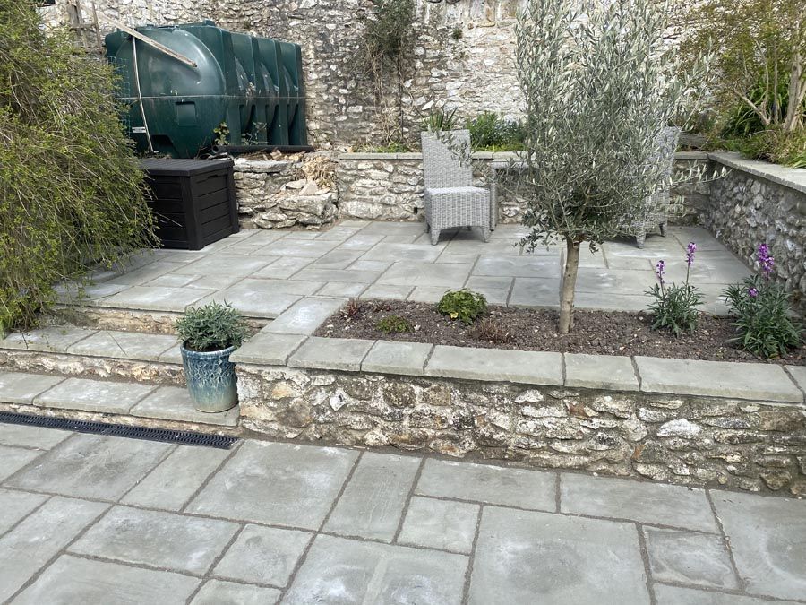 Raised patio with plant bed